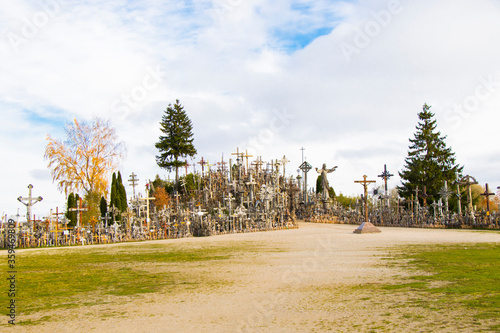 Hill of crosses, large group of crosses on the hill in Lithuania, Famous landmark, must visit place. photo