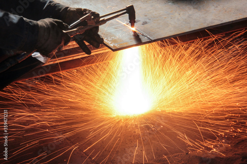 Oxy-fuel cutting. In oxy-fuel cutting, a torch is used to heat metal to its kindling temperature. A stream of oxygen is then trained on the metal, burning it into a metal oxide.