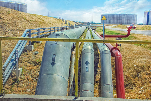 Pipelines and storage tanks of the crude oil in the refinery. © Funtay