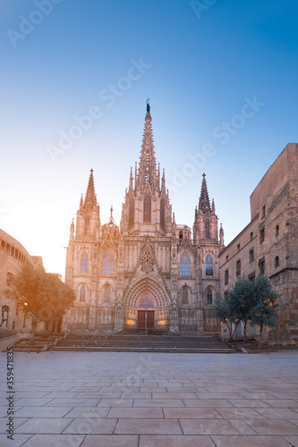 Cathedral of Barcelona at sunrise. Gothic Barcelona Cathedral at dawn with rising Sun, panoramic image, panorama with text space.