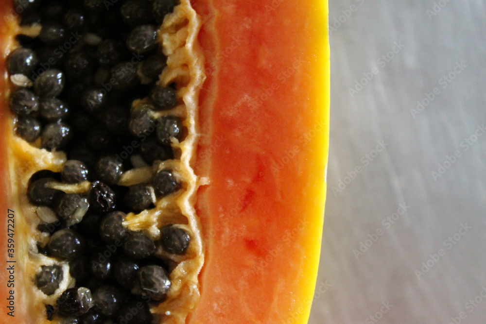 Close up of papaya fruit on the kitchen table. Close up of papaya fruit on the kitchen table.