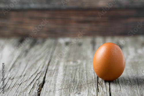 Close-up view of raw eggs isolated on Brown background.