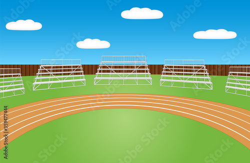 Sports field with running track and empty bleachers