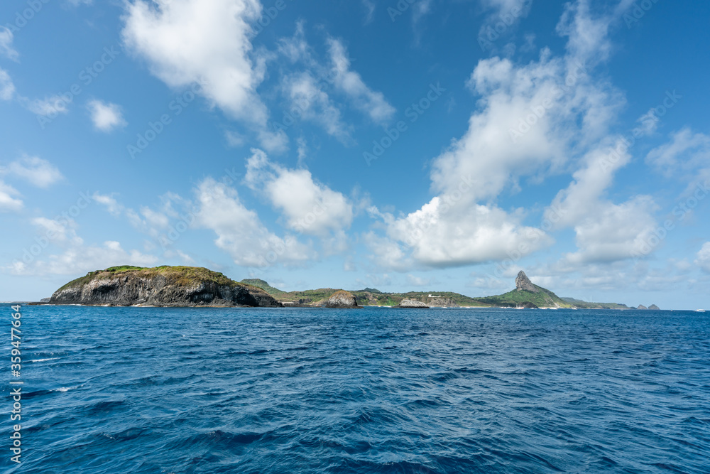 Beautiful view of Morro do Pico from the sea at Fernando de Noronha, a Unesco World Heritage site, Pernambuco, Brazil Beautiful view of Morro do Pico from the sea at Fernando de Noronha, a Unesco World Heritage site, Pernambuco, Brazil