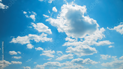 White hairy clouds on a blue sky. Use as background.