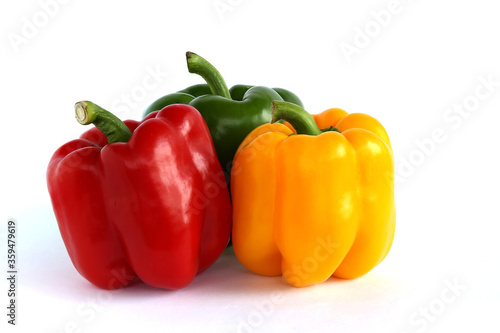 Red, yellow, green bell peppers isolated white background