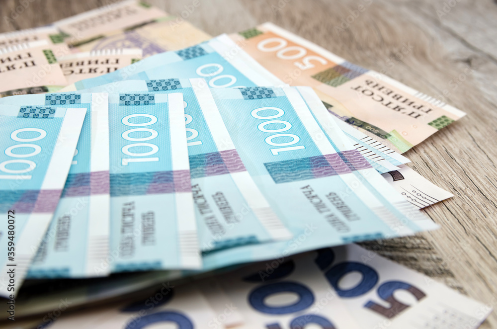 hryvnia banknotes on a wooden table. Close-up. Financial concept. Banknotes of 1000 and 500 hryvnia. Much money. hryvnia banknotes on a wooden table. Close-up. Financial concept. Banknotes of 1000 and 500 hryvnia. Much money.