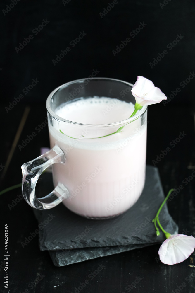 Vegan pink Moon milk on black background. a dreamy sleep tonic. Vegan pink Moon milk on black background. a dreamy sleep tonic.