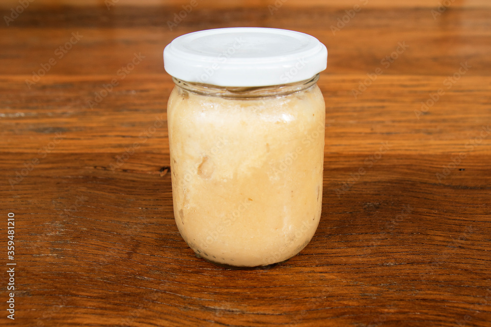 Nutrition concept - Green Banana Biomass in glass jar, good source of fiber, vitamins and minerals, and contains a starch that may help control blood sugar, manage weight and lower blood cholesterol. Nutrition concept - Green Banana Biomass in glass jar, good source of fiber, vitamins and minerals, and contains a starch that may help control blood sugar, manage weight and lower blood cholesterol.