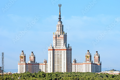 famous moscow city skyline with moscow university skyscraper building closeup facade view against blue sky background. Stalin era historical empire style architecture tourist attraction