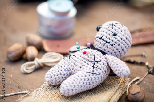 Voodoo Doll on a wooden bac...