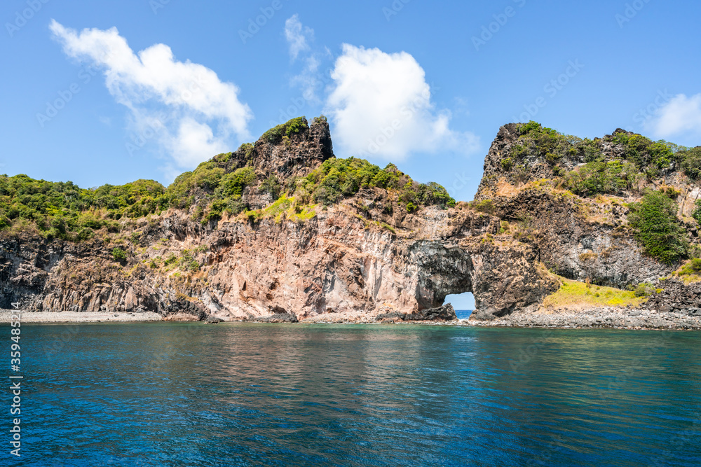 Beautiful view of the Ponta da Sapata rocks from the sea at Fernando de Noronha, a Unesco World Heritage site, Pernambuco, Brazil