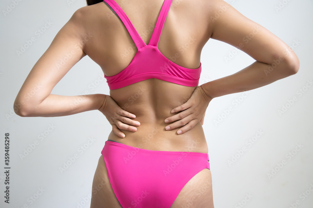 woman sufferring from back pain at lumber spine or spinal herniated disc woman sufferring from back pain at lumber spine or spinal herniated disc