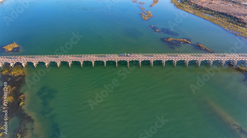 Aerial photo of Quinta de Lago, Almancil, Algarve, Portugal. Bridge over the beach. Dunes.