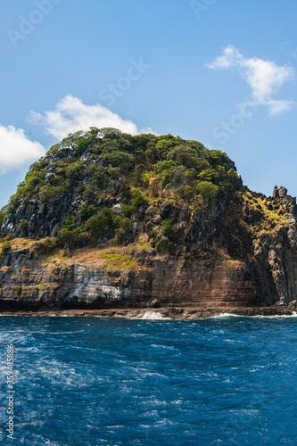 Beautiful view of the Ponta da Sapata rocks from the sea at Fernando de Noronha, a Unesco World Heritage site, Pernambuco, Brazil