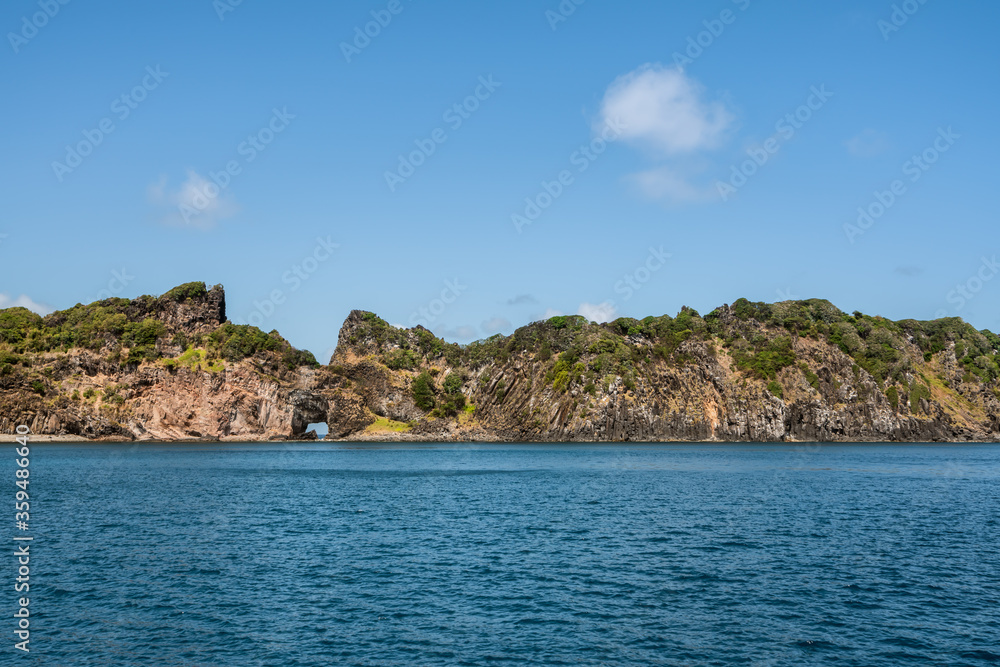 Beautiful view of the Ponta da Sapata rocks from the sea at Fernando de Noronha, a Unesco World Heritage site, Pernambuco, Brazil, July 2019