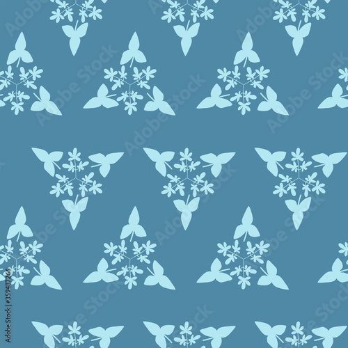 Vector pattern of triangles.The triangles consist of the leaves. Delicate blue color scheme.Hand drawn floral seamless pattern and backdrop.Elegant plant background.Desing for wallpaper,textile.