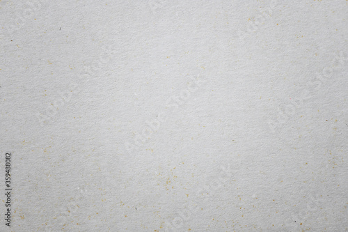 Old cardboard background texture. Closeup of white and gray paper wallpaper