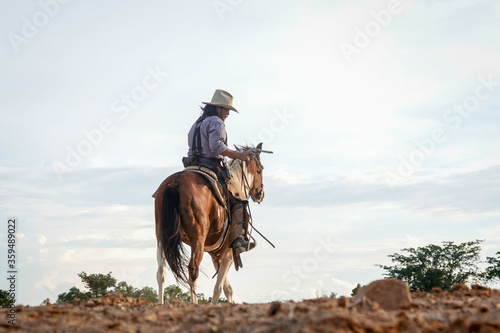 Action scenes of a cowboy, a man riding a horse and shooting a gun