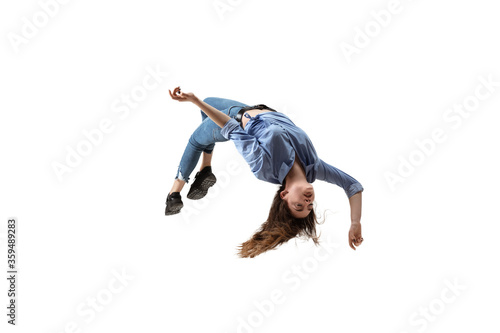Mid-air beauty cought in moment. Full length shot of attractive young woman hovering in air and keeping eyes closed. Levitating in free falling, lack of gravity. Freedom, emotions, artwork concept. © master1305