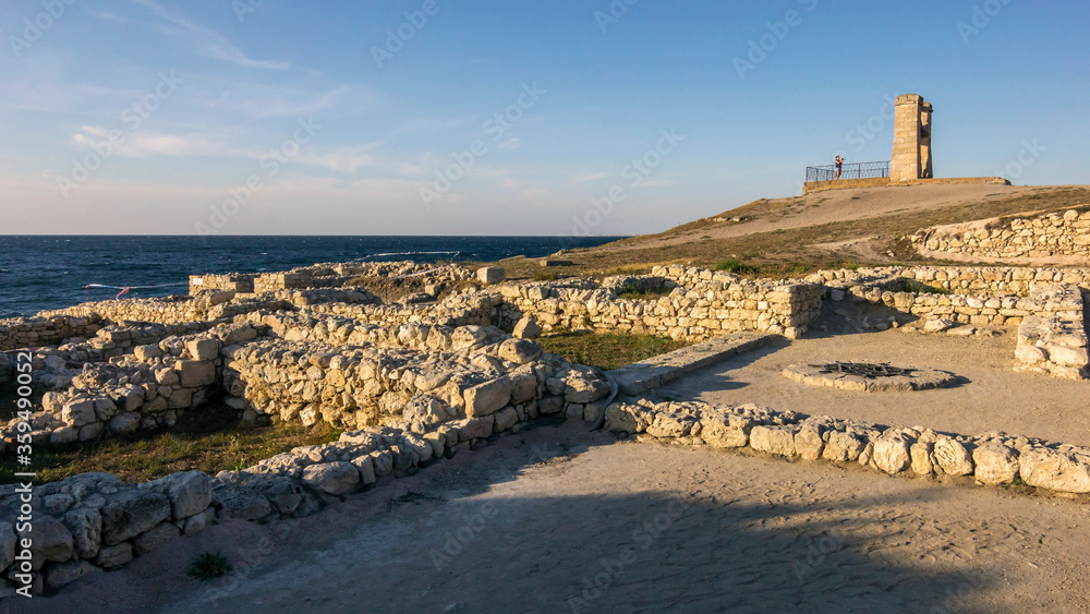 Tauric Chersonesus. Ruins of an ancient city on the beach at sunset. Ruins, antique columns. 
