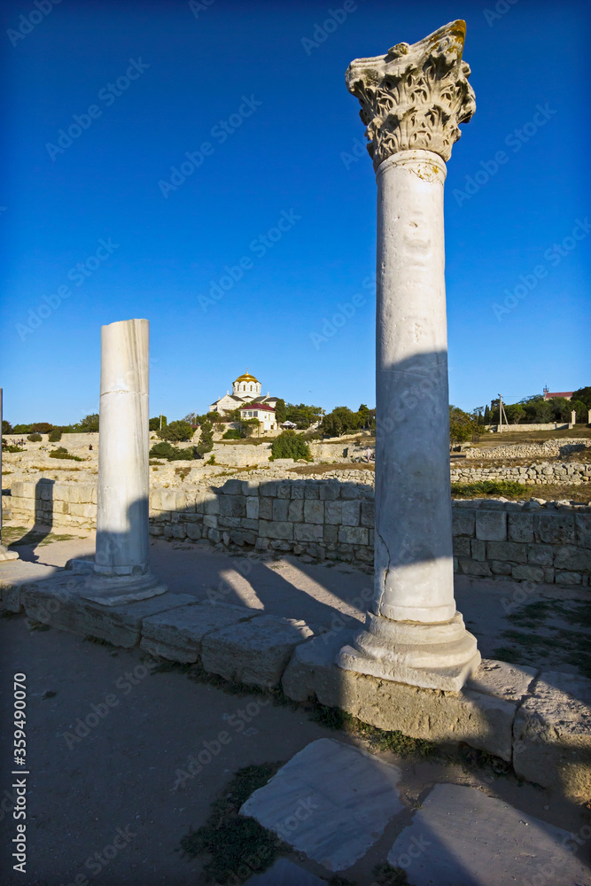 Tauric Chersonesus. Ruins of an ancient city on the beach at sunset. Ruins, antique columns. Vladimir cathedral. 