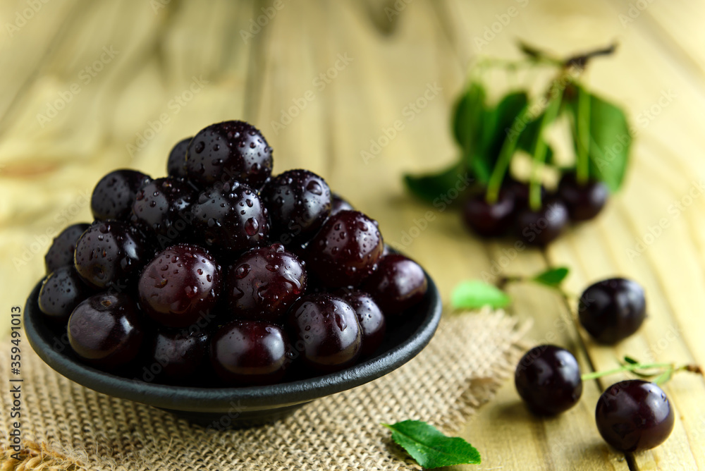 Fresh sour cherries in bowl Fresh sour cherries in bowl