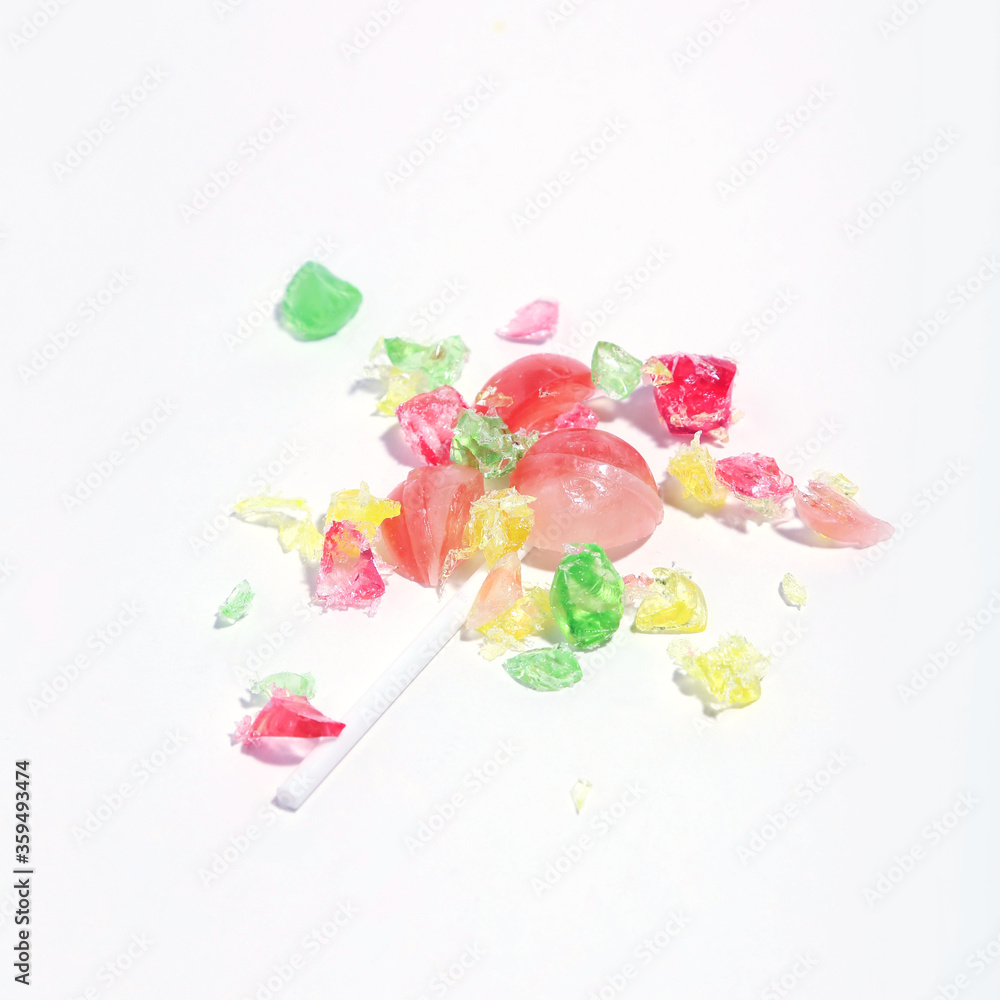 Crumbled candy on white background. Minimalism concept