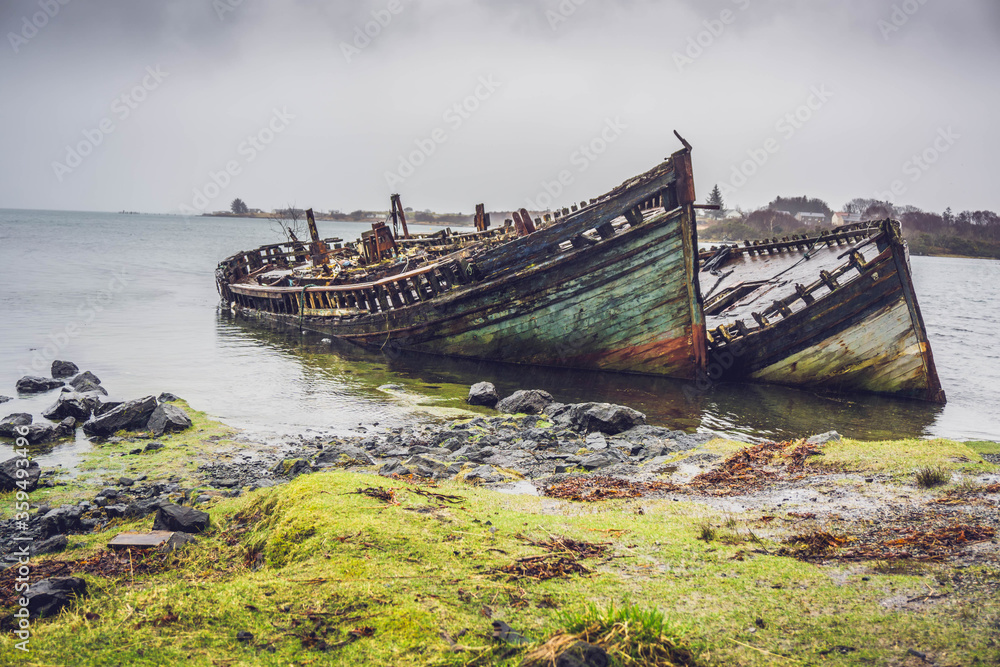 Sinking ships at the shore on Isle of Mull, Scotland.