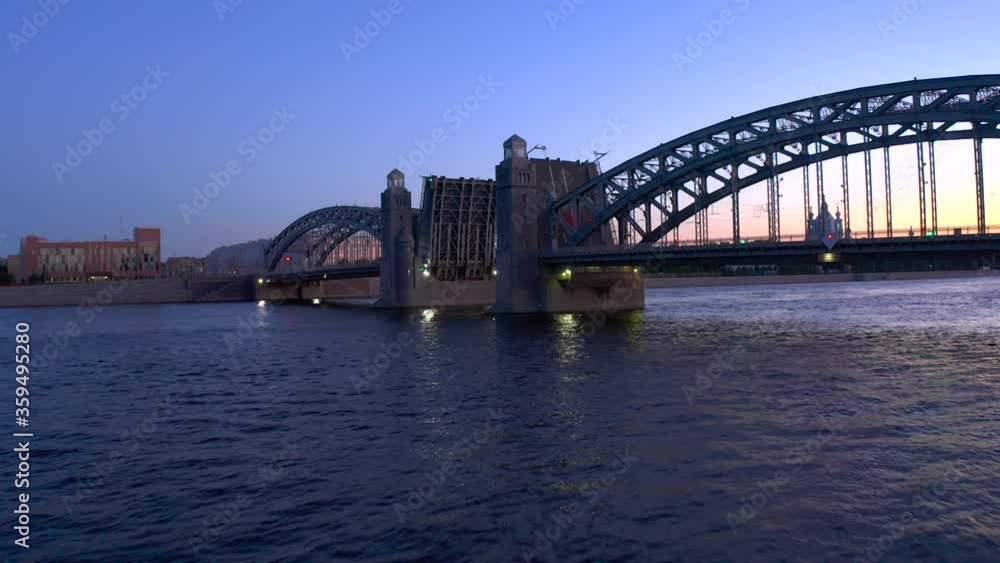 The Bolsheokhtinsky Bridge is a beautiful drawbridge across the Neva River in St. Petersburg. White Nights. The Bridge of Peter the Great. The Bolsheokhtinsky Bridge is a beautiful drawbridge across the Neva River in St. Petersburg. White Nights. The Bridge of Peter the Great.