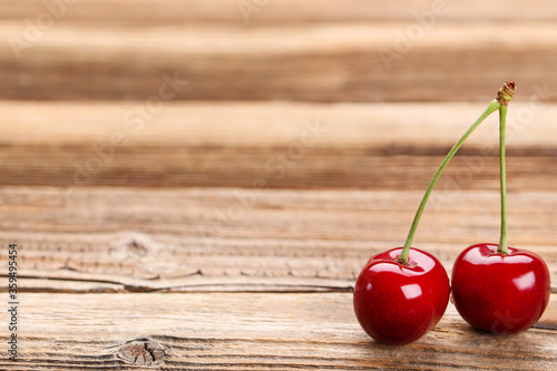 Sweet cherries on brown wooden table