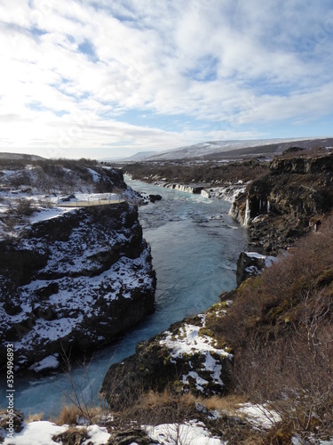 River running through snowy rocks in Iceland