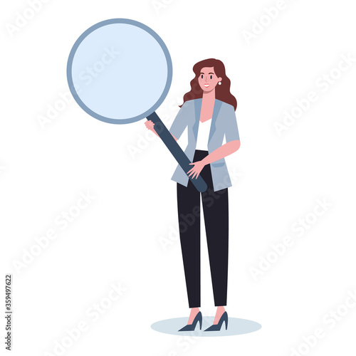 Business person in formal office clothes holding a magnifying glass.