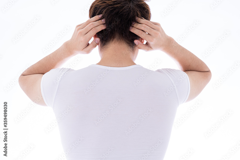 A man feeling exhausted and suffering from neck and head pain and injury on isolated white background. Health care and medical concept. A man feeling exhausted and suffering from neck and head pain and injury on isolated white background. Health care and medical concept.
