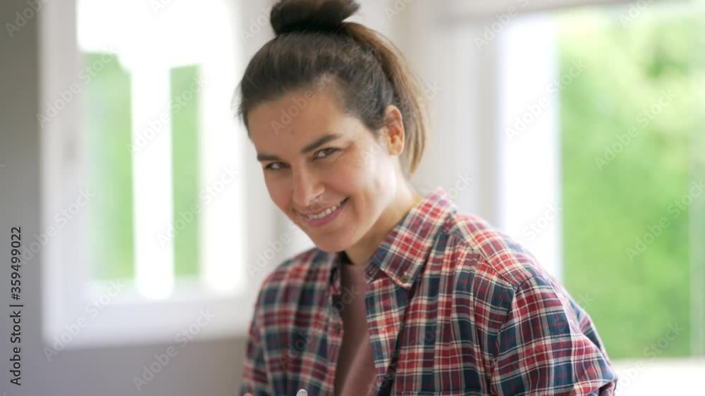 Portrait of beautiful and smiling dark-haired woman relaxing at home Portrait of beautiful and smiling dark-haired woman relaxing at home