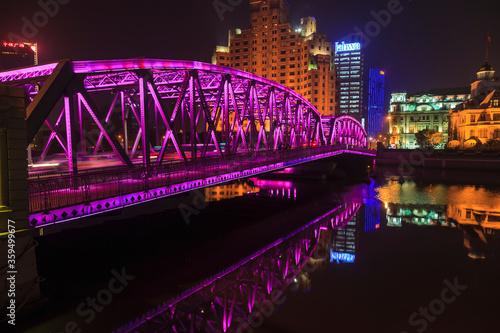 View on colorful illuminated Waibaidu bridge in Shanghai at night