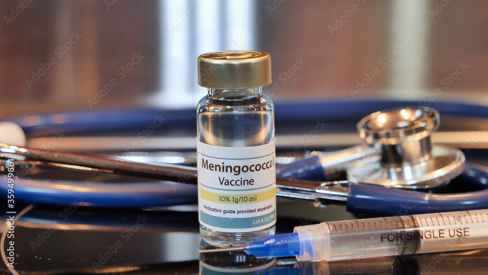 Vial of Meningococcal vaccine whit syring and stethoscope