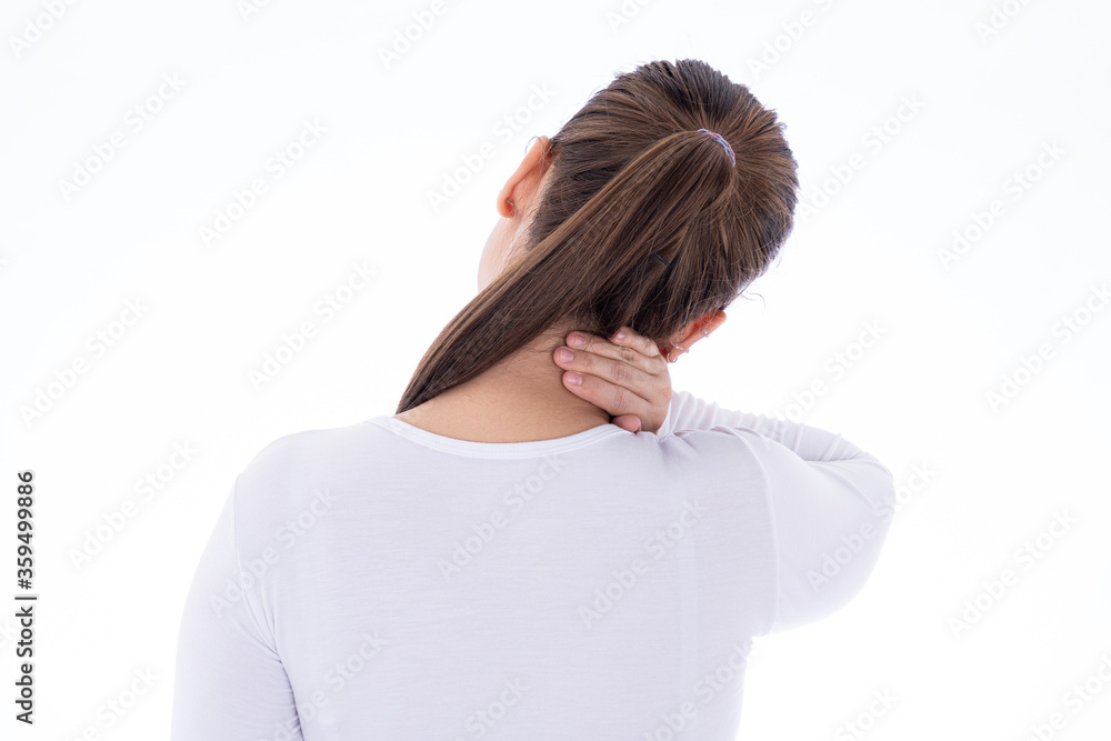 A woman feeling exhausted and suffering from shoulder and neck pain and injury on isolated white background. Health care and medical concept. A woman feeling exhausted and suffering from shoulder and neck pain and injury on isolated white background. Health care and medical concept.