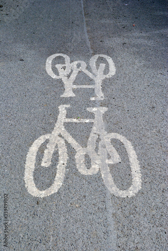 Bicycle Signs Painted on Grey Tarmac of Empty Public Road 