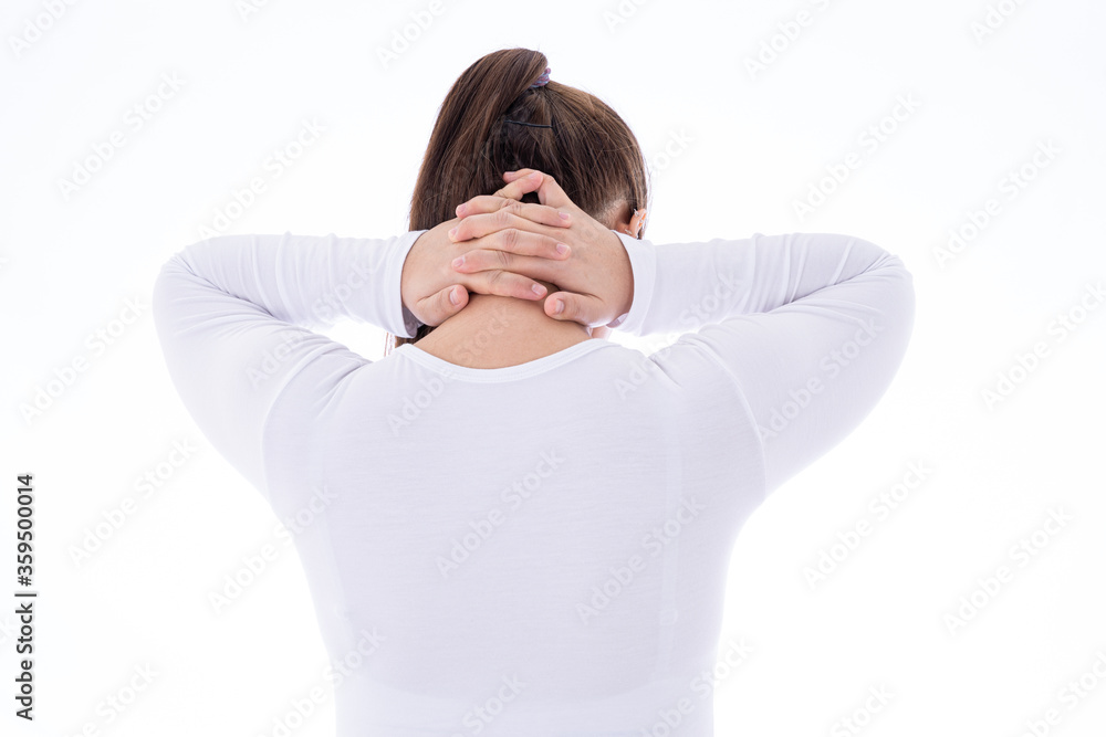 A woman feeling exhausted and suffering from shoulder and neck pain and injury on isolated white background. Health care and medical concept. A woman feeling exhausted and suffering from shoulder and neck pain and injury on isolated white background. Health care and medical concept.