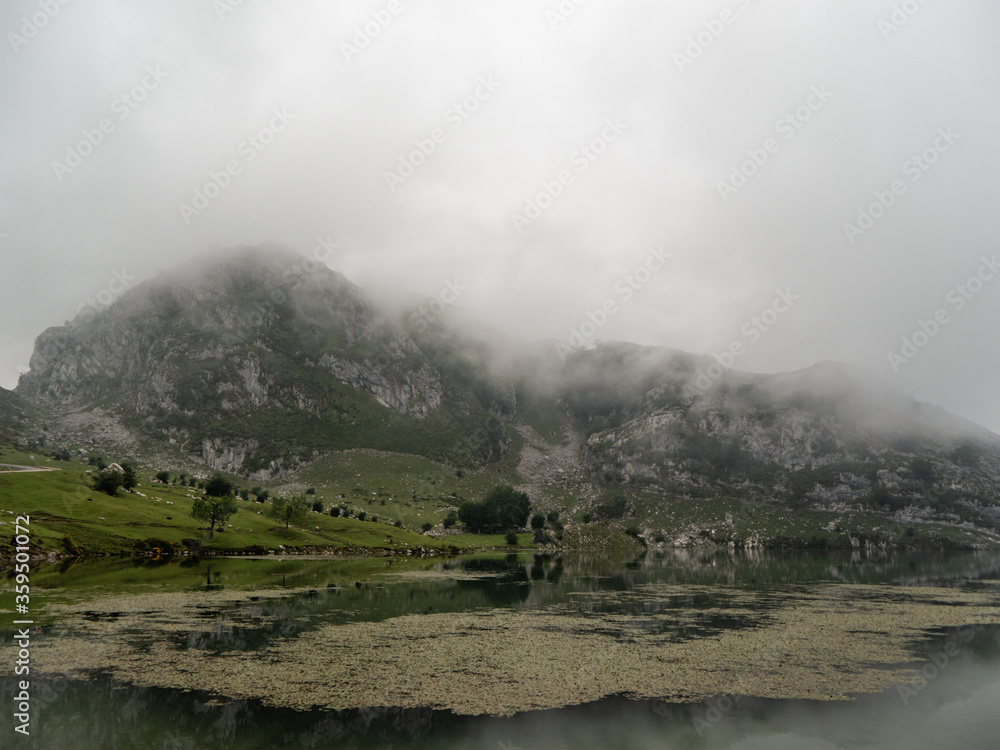 Misty valley with a lake