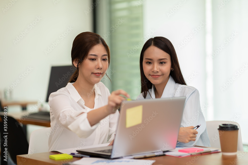 two young business woman Startup coworkers working together to get ideas and marketing at office,Business Startup Diversity Brainstorming Concept two young business woman Startup coworkers working together to get ideas and marketing at office,Business Startup Diversity Brainstorming Concept