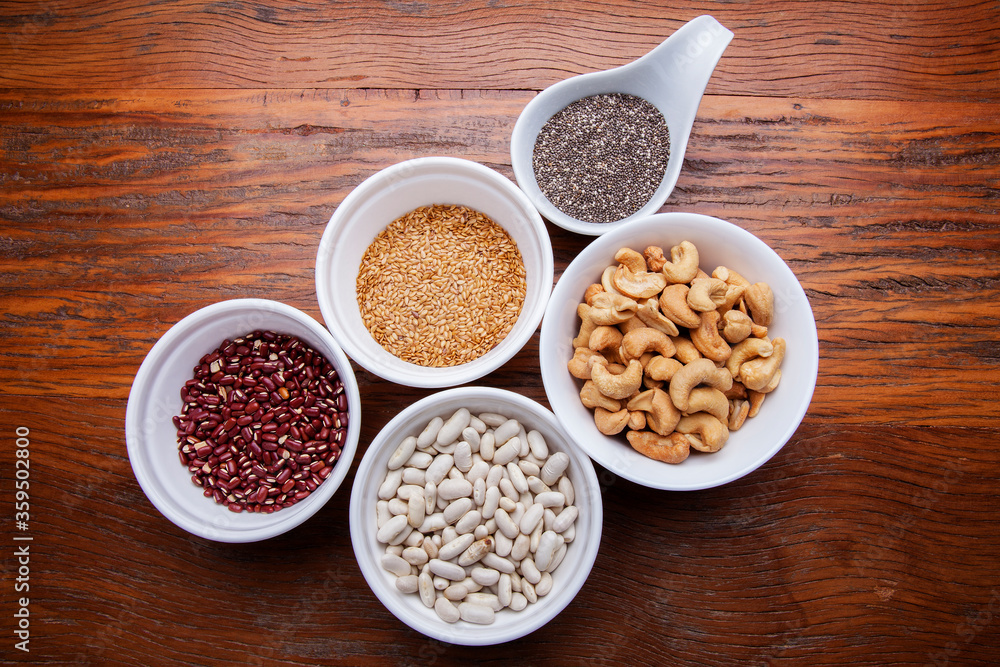 Nutrition concept -Healthy grains food selection in round bowls over wooden background. Healthy food, Diet, Detox, Clean Eating or Vegetarian concept Nutrition concept -Healthy grains food selection in round bowls over wooden background. Healthy food, Diet, Detox, Clean Eating or Vegetarian concept