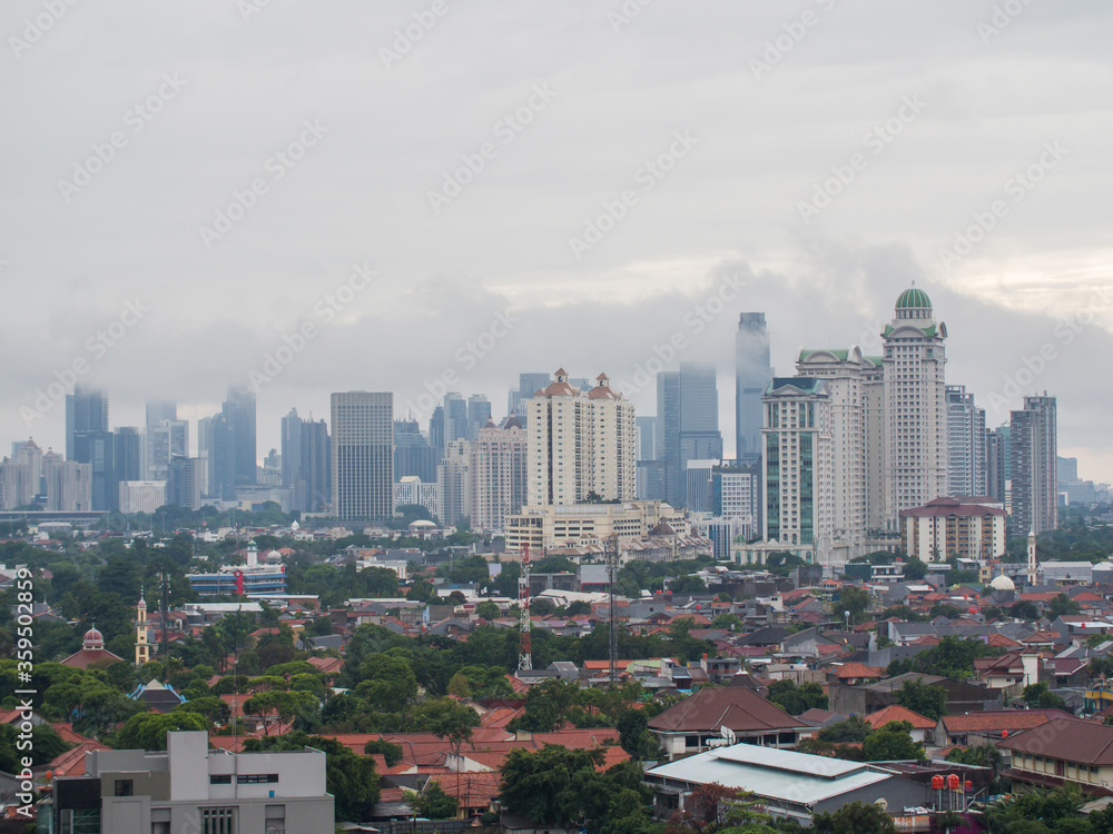 Fototapeta premium Panorama of the city of Jakarta, the capital of Indonesia, in cloudy weather.