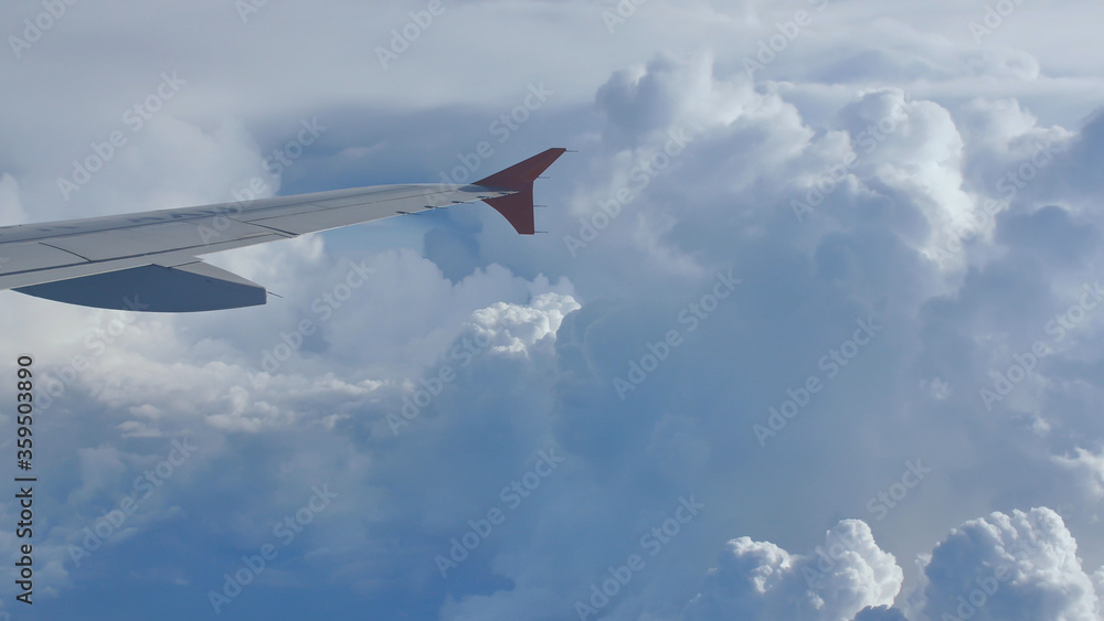 Storm clouds and part of the wing of the aircraft window. Storm clouds and part of the wing of the aircraft window.