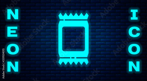 Glowing neon Fertilizer bag icon isolated on brick wall background.  Vector Illustration