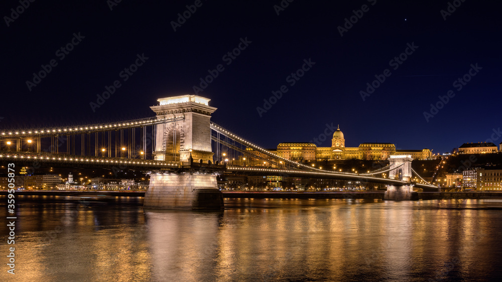 The Royal palace of Buda and the Chain Bridge in Budapest, Hungary by night