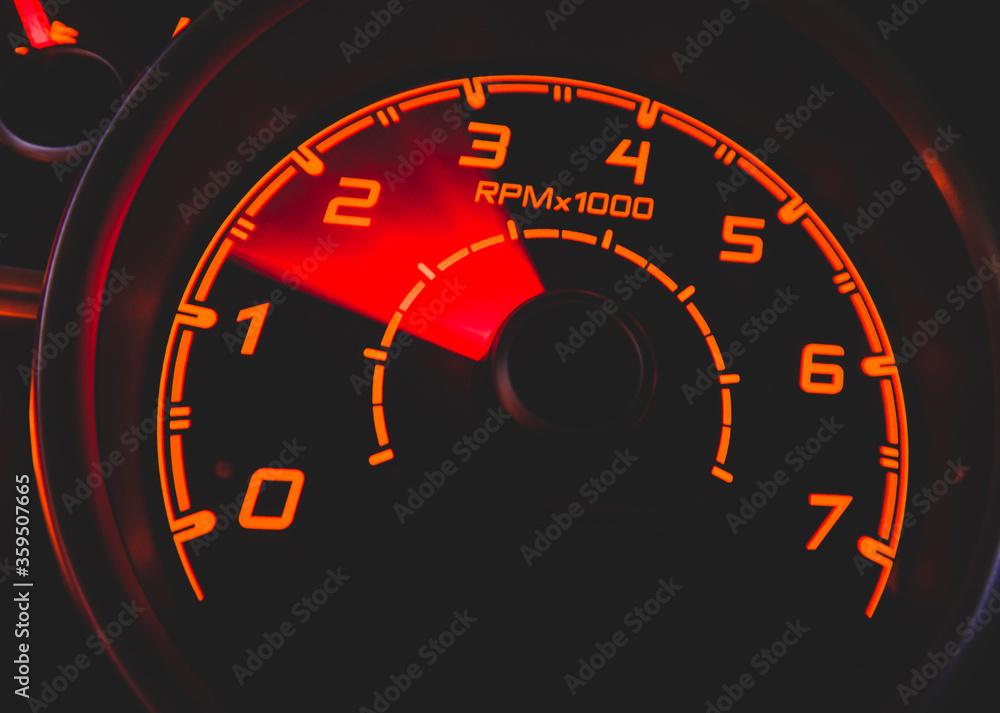 Driver's cockpit ; speedometer on dashboard - colorful light in black, copy space for your abstract design	