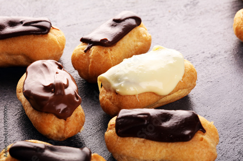 Traditional French dessert. Eclair with chocolate icing. Pastery dessert concept photo