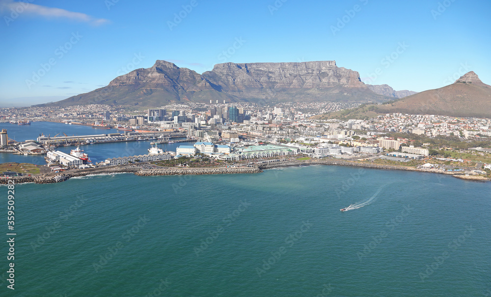 Cape Town, Western Cape / South Africa - 05/24/2019: Aerial photo of V&A Waterfront and Table Bay Hotel with Table Mountain in the background